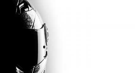 Close-up of a futuristic robots head in black and white, with a dark visor and metallic details, against a stark white background.