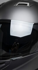 Close-up of a motorcycle helmet with a white cloth on the visor, highlighting safety gear.