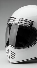 Close-up of a stylish white motorcycle helmet with a dark visor, showcasing its sleek design and protective features.