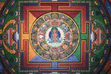 Diqing, China - 19 November 2025: View of the vibrant mandala art, a kaleidoscope of intricate patterns and spiritual symbolism, radiates from the temple ceiling.