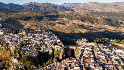 Wandcirkels Ronda Puente Nuevo Aerial view of Ronda landscape and buildings with Puente Nuevo Bridge, Andalusia, Spain  © anderm