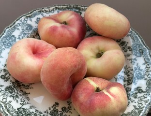 Fresh fig peaches on the green plate