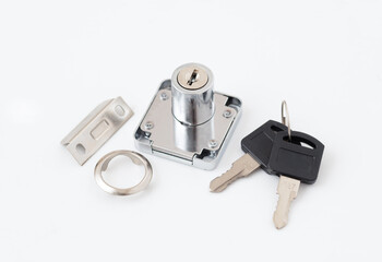 Metal cabinet lock with two keys and fittings on white background.