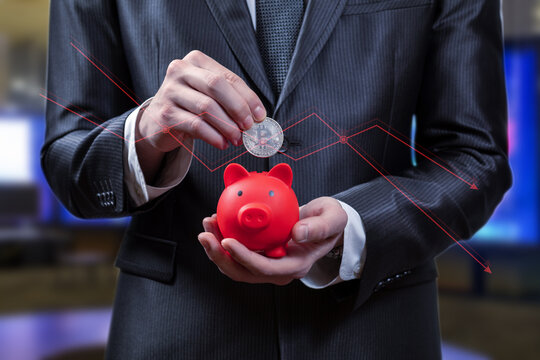 Saving coins in pig.