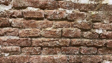 Very old weathered brick wall, close-up picture, horizontal.