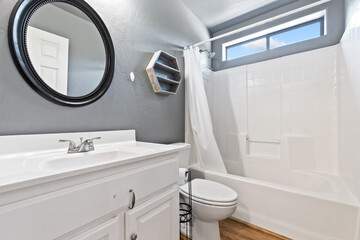 Modern Bathroom with White Fixtures and Natural Light