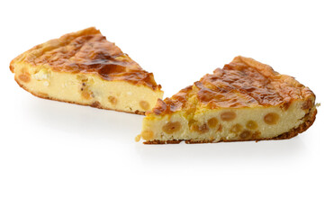 Two pieces of cottage cheese pie with raisins on white background