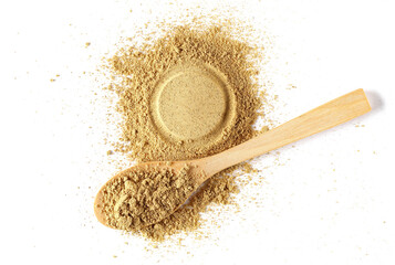 Ginger powder in wooden spoon isolated on white, top view