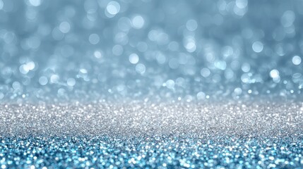 Fototapeta premium Glittering blue and silver specks shimmer softly creating a vibrant and festive atmosphere for events.