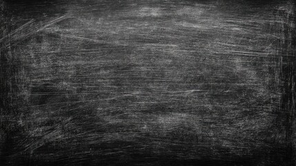 Fototapeta premium The chalkboard features a textured surface filled with scratches and markings inviting new ideas.