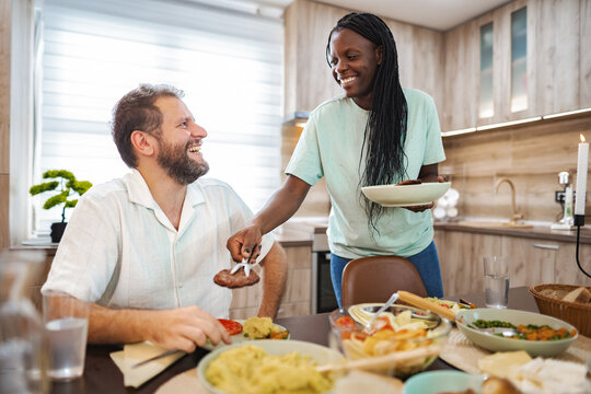 Joyful dinner with tasty food in a cozy kitchen