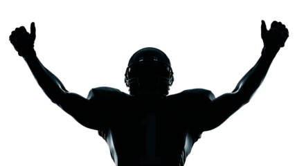 Silhouette powerful American football athlete raising arms triumphantly in dramatic low-key lighting symbolizing victory strength teamwork determination celebration spirit on white background