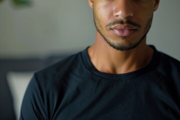 Young adult man looking serious in a casual setting