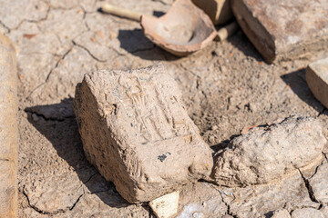 Close-up view of Cuneiform writing at the ruins of Uruk, a major ancient city in Mesopotamia, Iraq