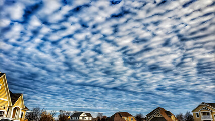 houses with clouds in the sky