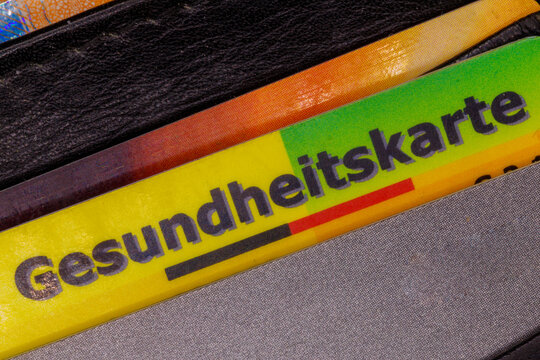 Gesundheitskarte german health insurance card in wallet close-up - Powered by Adobe