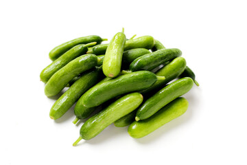 Fresh mini baby cucumbers on white background
