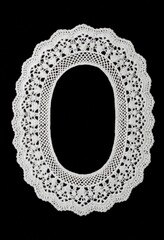 Decorative white lace oval collar frame on black background