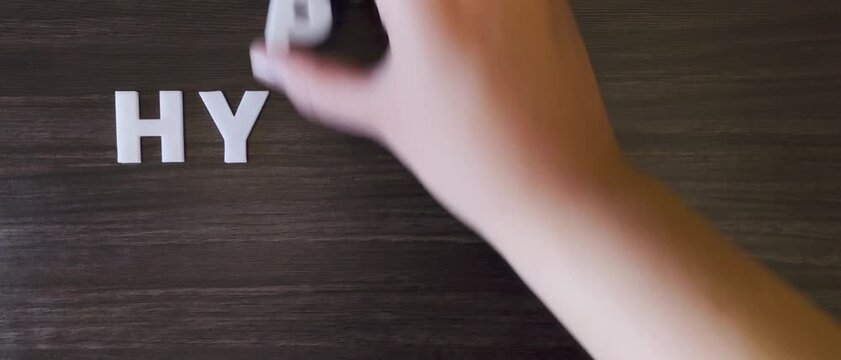 the word hypotension written on a dark background with white block letters or  capital letters