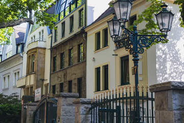 Elegant historic street with old houses and ornate street lamps in Dusseldorf, Germany