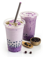 Taro milk tea with vibrant purple hue served in clear cups. Taro milk tea features chewy tapioca pearls, ice, and refreshing flavors complemented by a straw.