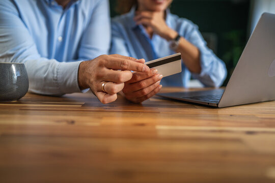 Couple holding credit card for online shopping payment