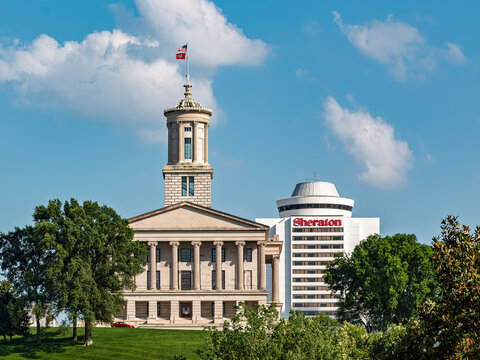 Sheraton Grand Nashville Downtown next to the Tennessee State Capitol on a beautiful summer day with some clouds in the sky