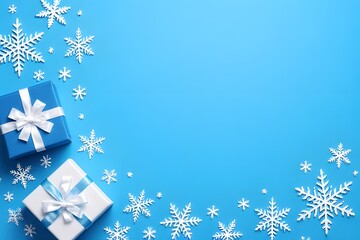 Elegant winter themed composition showcasing wrapped gift boxes with delicate white bows surrounded by assorted snowflakes arranged on a vibrant light blue backdrop.