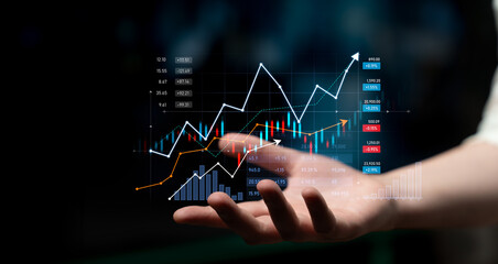 A hand showcases a digital display of stock market data, including line graphs and candlestick charts, representing growth and financial performance in business. Scalp