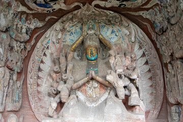Fototapeta premium Thousand-hand Guanyin or Goddess of Mercy, sculpture at Beishan Rock Carvings in Dazu, China.