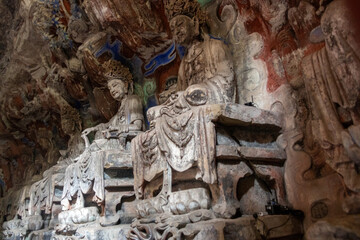 Detail carved sculptures at Dazu Rock Carvings on Mount Baoding, Dazu, China.