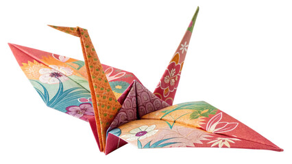 Photo of colorful origami paper crane with floral pattern folded from patterned paper isolated on transparent background