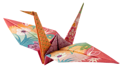 Photo of colorful origami paper crane with floral pattern folded from patterned paper isolated on transparent background