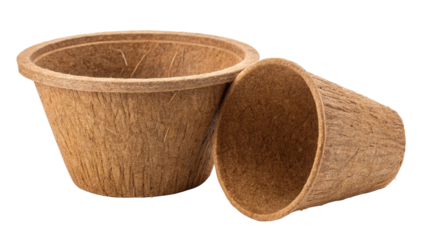 Photo of two empty biodegradable coir fiber planting pots, one upright and one tipped over, isolated on transparent background