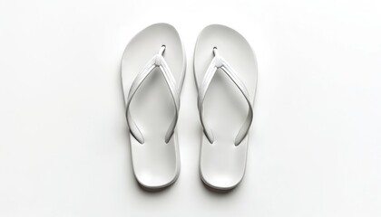 Fototapeta premium Top view shows white flip flops on plain background. Isolated pair of summer footwear perfect for vacation. Casual sandals useful for summer holiday travel to beach sea resort at summertime.