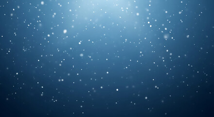 Abstract blue background with shimmering particles floating in a gentle light from above.