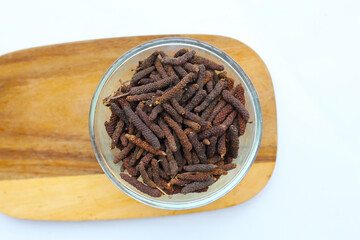 Long pepper (Piper longum), a spice used in traditional medicine and cooking, known for its pungent flavor.
