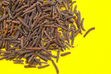 Long pepper (Piper longum), a spice used in traditional medicine and cooking, known for its pungent flavor.