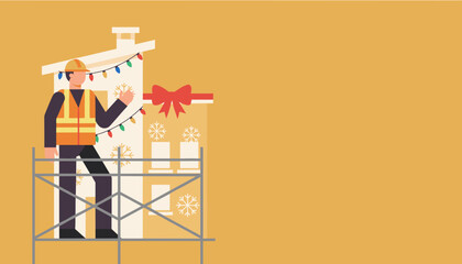 Builder on scaffolding installs holiday decorations and lights on a winter house facade