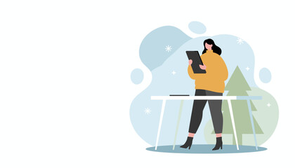 Woman uses tablet for remote work or holiday shopping in a cozy winter setting