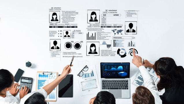 A diverse team collaborates in a business meeting, analyzing data and presenting various graphs while utilizing laptops and visual reports on a modern corporate workspace. Trope
