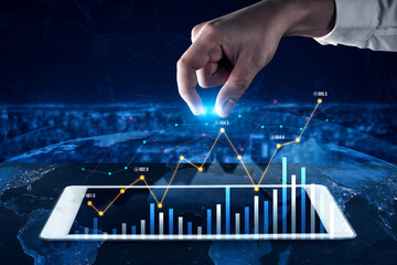 A hand reaching for a glowing point above a digital graph on a tablet, symbolizing data analysis and global business insights using modern technology. Scalp
