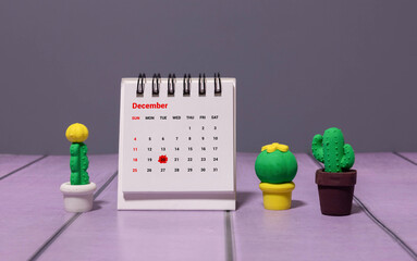 December, 20 on calendar on wooden table close-up