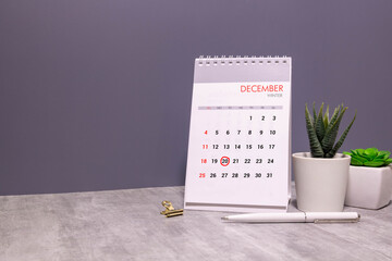 December, 20 on calendar on wooden table close-up