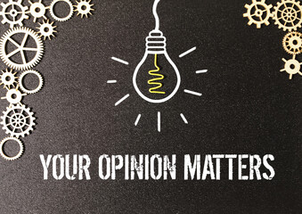 Your Opinion Matters. yellow sticker on a yellow notebook. on a wooden table.