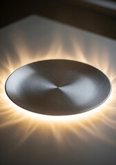 Circular Brushed Metal Surface Emanating Radiant, Warm Illumination