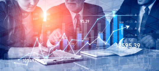 Business professionals engage in financial analysis, discussing charts and graphs that illustrate market trends and strategic opportunities for growth in a modern workplace. Scalp