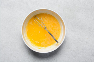 Overhead view of custard for making bread pudding, process of making bread pudding