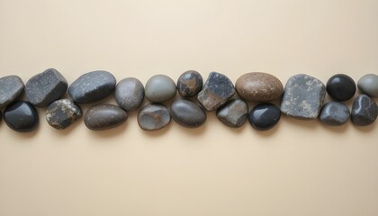 Smooth stones arranged neatly on a creamy background