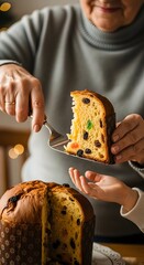 Person serving panettone slice to child with cake server during a holiday celebration moment indoors